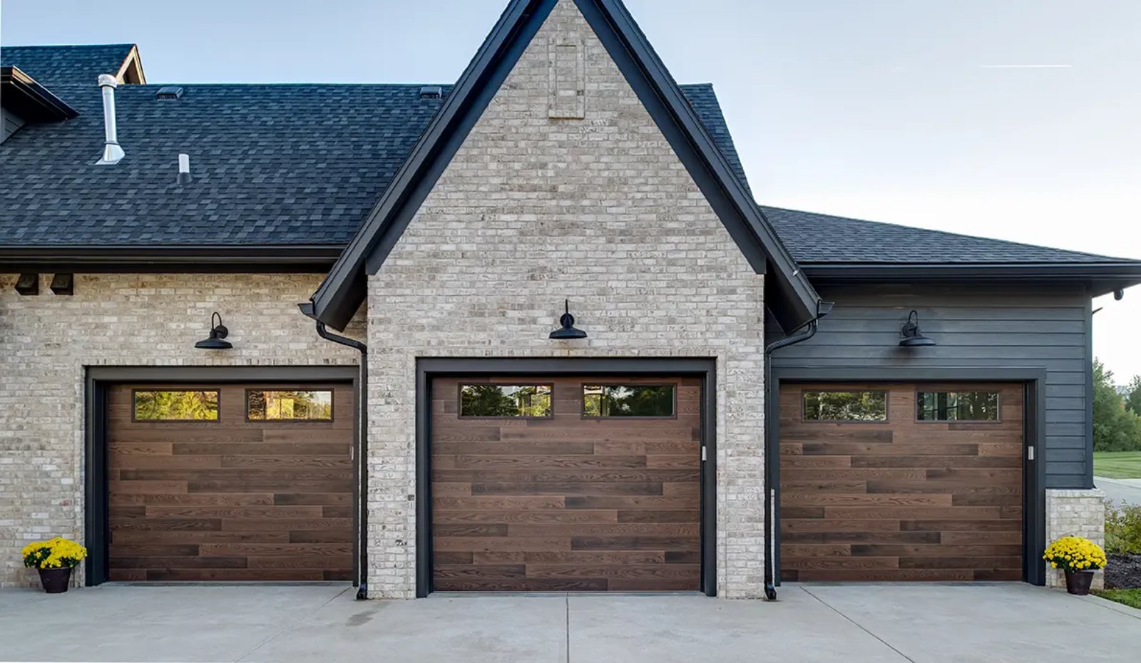 Clopay Modern Steel Ultra-Grain plank garage door in a wood finish