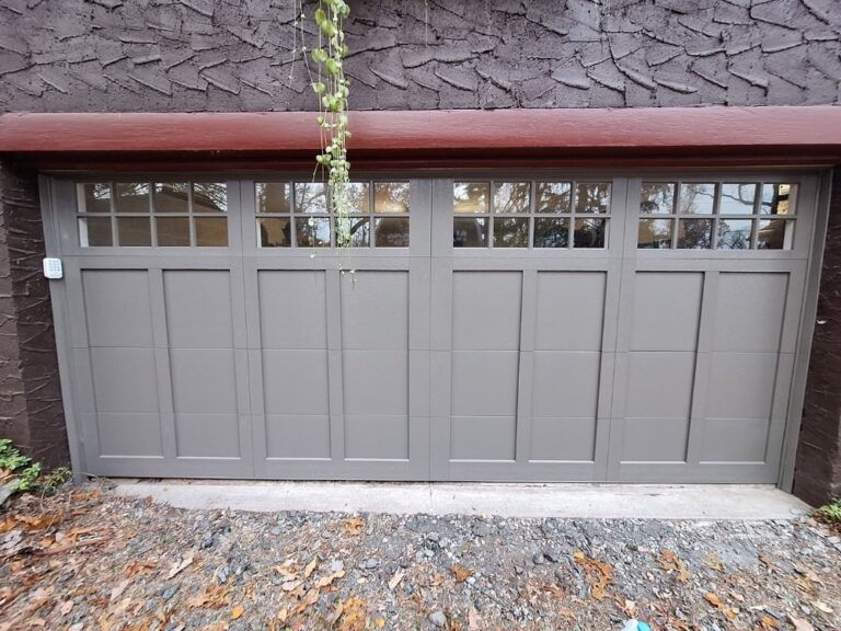 Carriage-style garage door with windows installed by NJ Garage