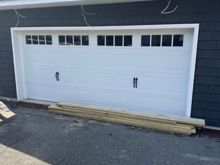 White double garage door with black window inserts, installed by NJ Garage