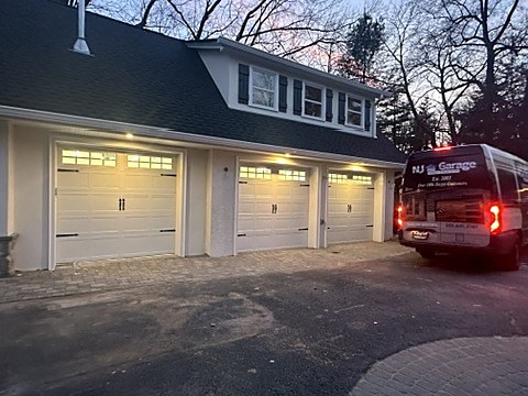 Almond carriage-house doors installed by NJ Garage in Woodcliff Lake, NJ