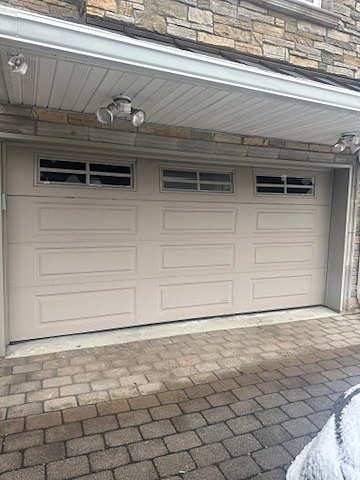 Almond garage door with windows installed by NJ Garage in Cliffside Park, NJ