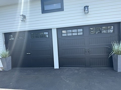 Black carriage-house doors with windows installed by NJ Garage in Washington Township, NJ