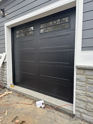 Black door with window row installed by NJ Garage in Scotch Plains, NJ