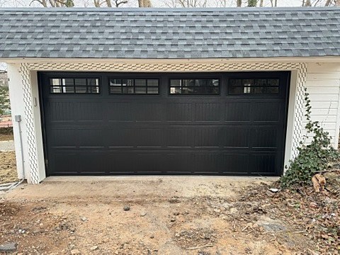 Black double door with window row installed by NJ Garage in Maplewood, NJ