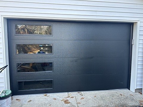 Black flush door with stacked windows installed by NJ Garage in River Edge, NJ