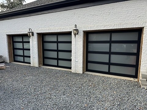 Black full-view aluminum and glass doors installed by NJ Garage in Holmdel, NJ