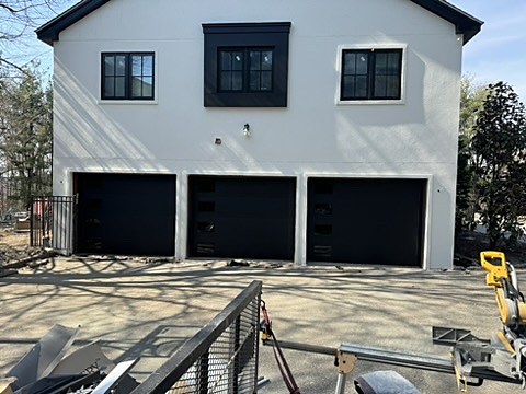 Black modern doors installed by NJ Garage in Cresskill, NJ