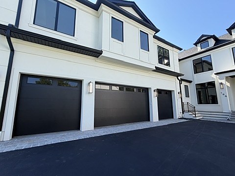 Black modern flush garage doors installed by NJ Garage in Paramus, NJ