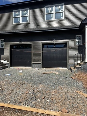 Black modern garage doors installed by NJ Garage in Raritan, NJ