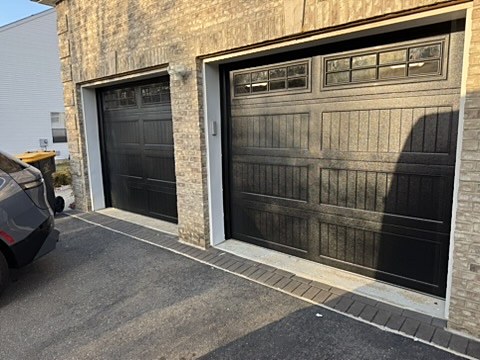 Black ribbed doors with windows installed by NJ Garage in Morganville, NJ