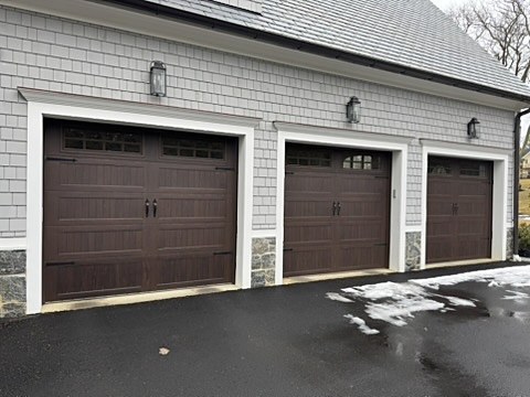 Brown carriage-house doors with windows installed by NJ Garage in Rumson, NJ