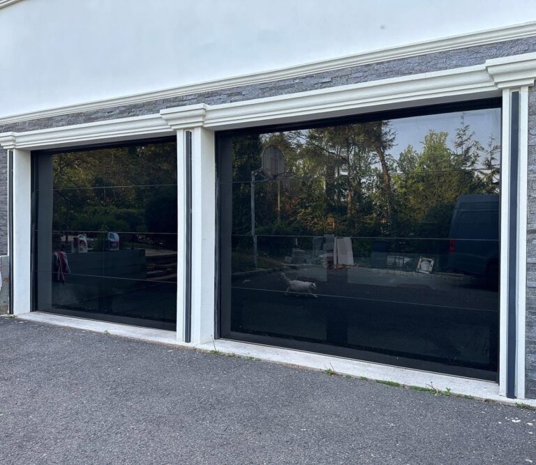 Two C.H.I. Sterling full-view glass garage doors installed by NJ Garage in Woodcliff Lake, NJ