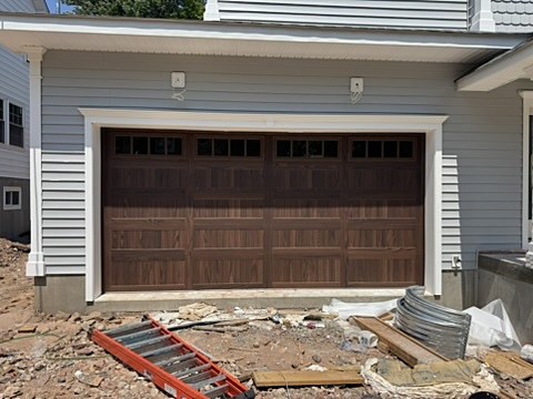 Dark woodgrain door with windows installed by NJ Garage in Maplewood, NJ