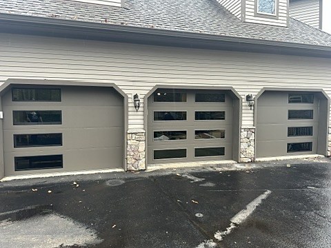 Grey flush doors with stacked windows installed by NJ Garage in Kinnelon, NJ