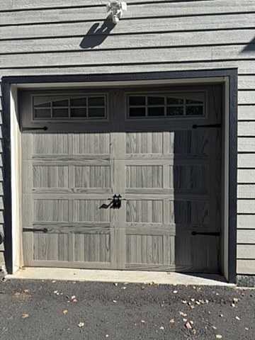 Grey woodgrain carriage-house door installed by NJ Garage in Belle Mead, NJ