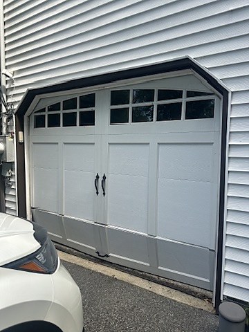 White carriage-house door with arched windows installed by NJ Garage in River Vale, NJ