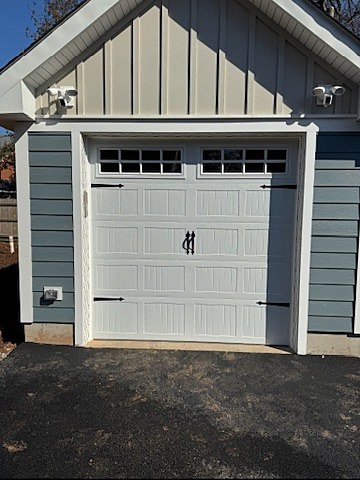 White carriage-house door with hardware installed by NJ Garage in Montclair, NJ
