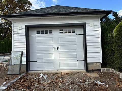 White carriage-house door with hardware installed by NJ Garage in Rutherford, NJ