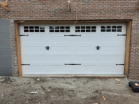 White carriage-house door with strap hinges installed by NJ Garage in Hillside, NJ