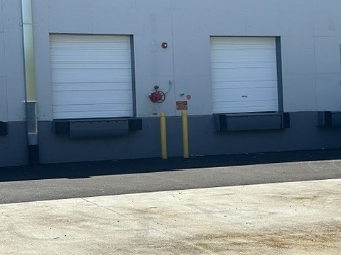 White commercial loading-dock doors installed by NJ Garage in Totowa, NJ