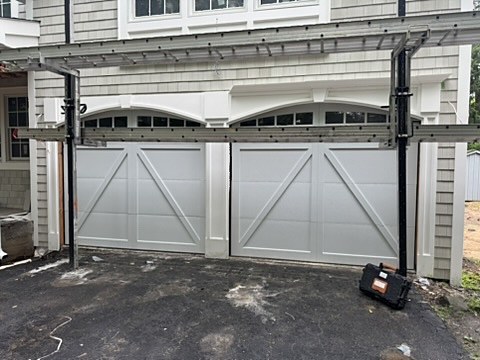 White crossbuck carriage-house doors installed by NJ Garage in River Vale, NJ