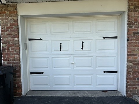 White door with black strap hinges installed by NJ Garage in West Orange, NJ