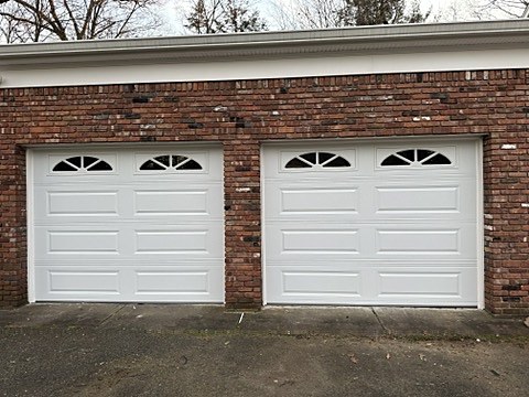 White doors with arched windows installed by NJ Garage in Ridgewood, NJ