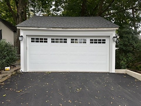 White double garage door with windows installed by NJ Garage in Maplewood, NJ