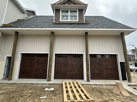 Woodgrain carriage-house doors installed by NJ Garage in Waretown, NJ